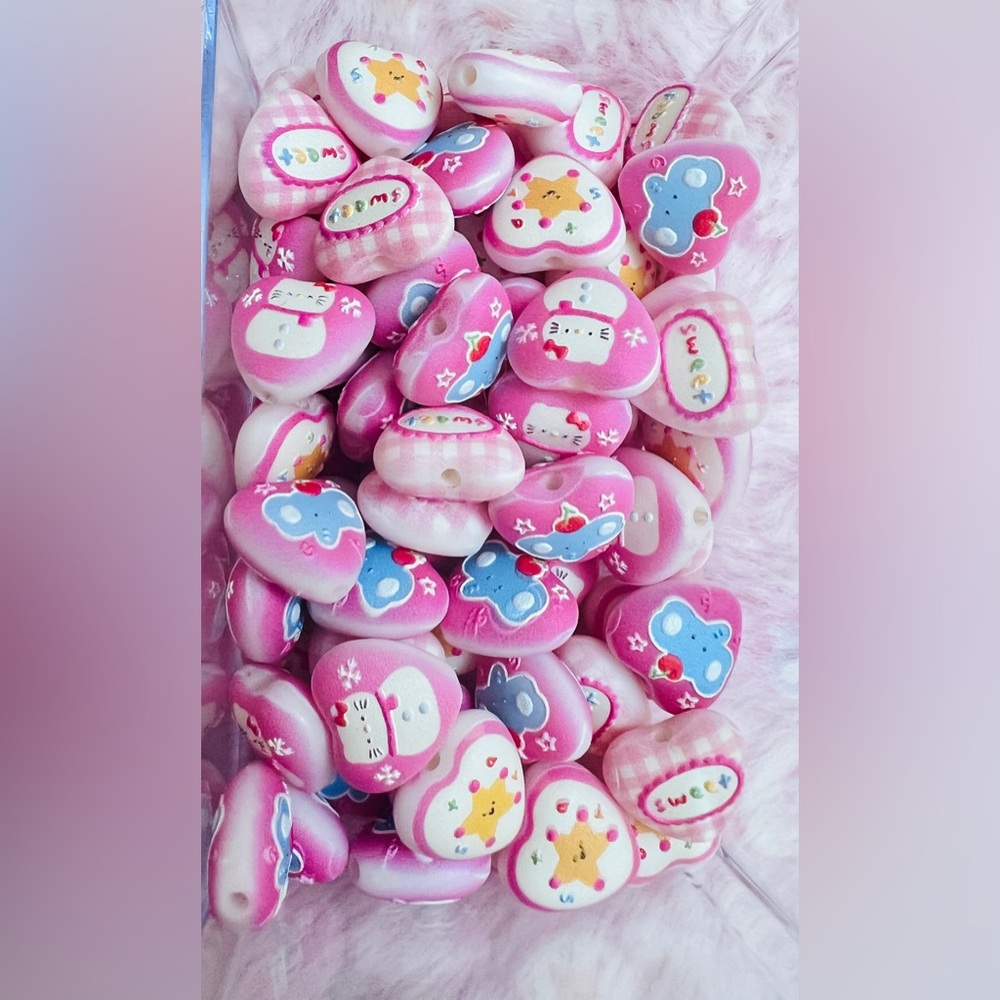 Pink Heart Beads with different gorgeous patterns on it for your DIY and design
